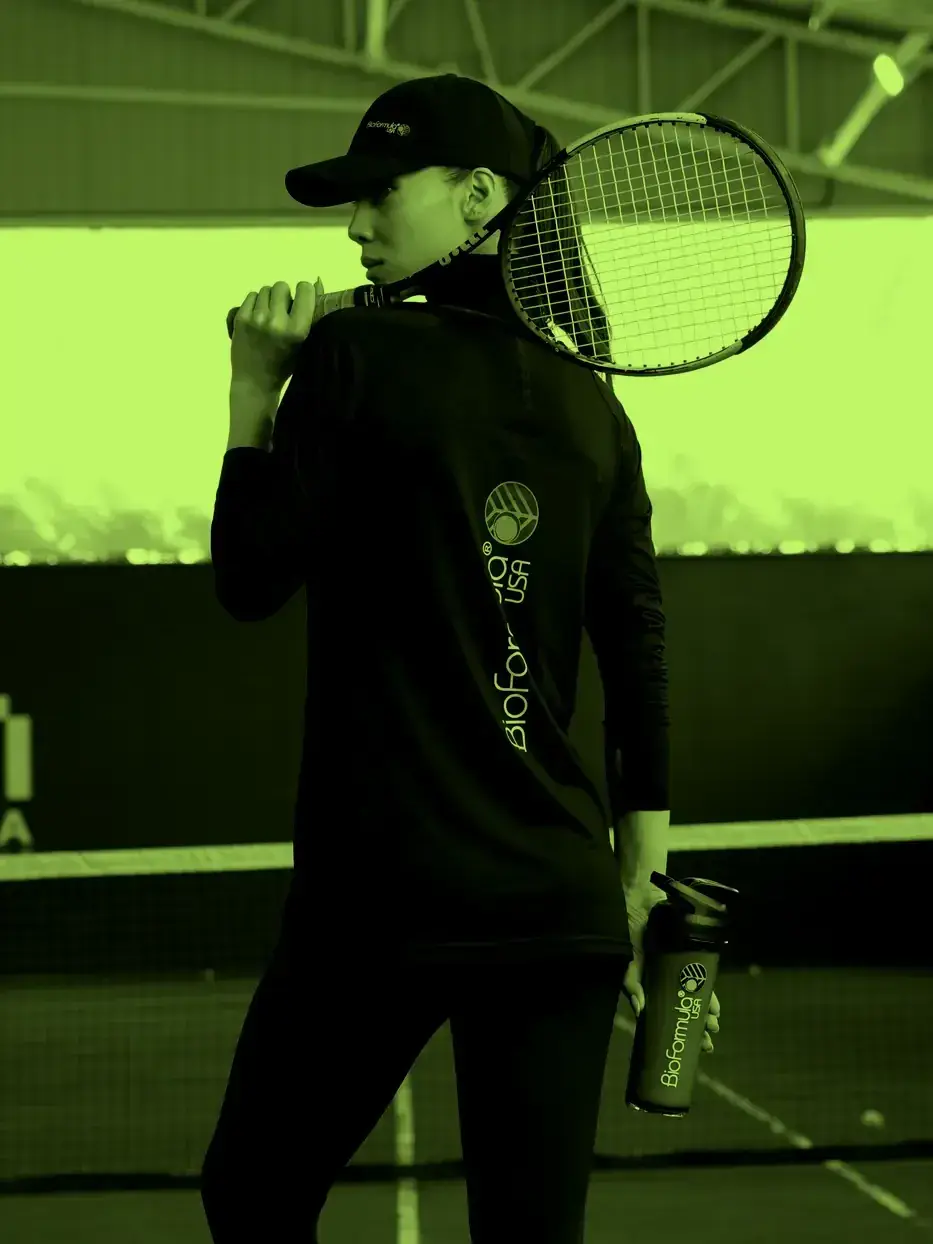An athlete in BioFormula training wear on a tennis court